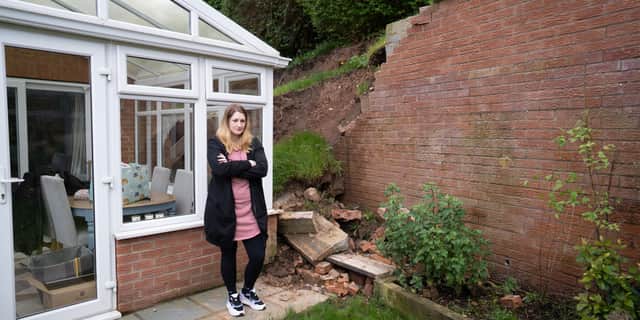Lucy Gawthorpe at her home where a wall has collapsed. 